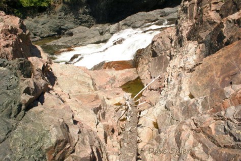 erosion along several of the many joints in the pink granite provides a partial view of the lower Chippewa Falls